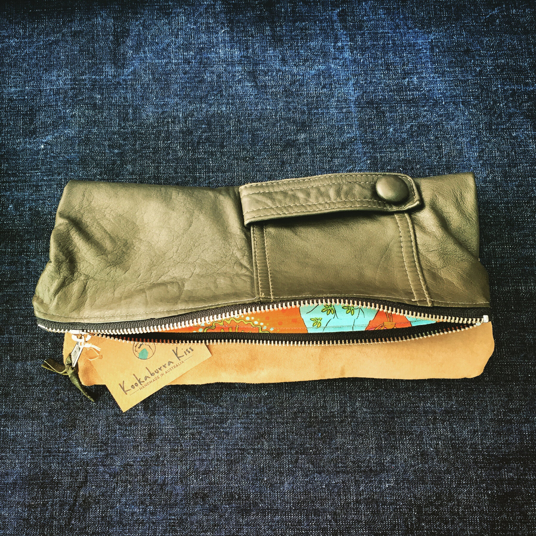 Green and ochre foldover leather clutch